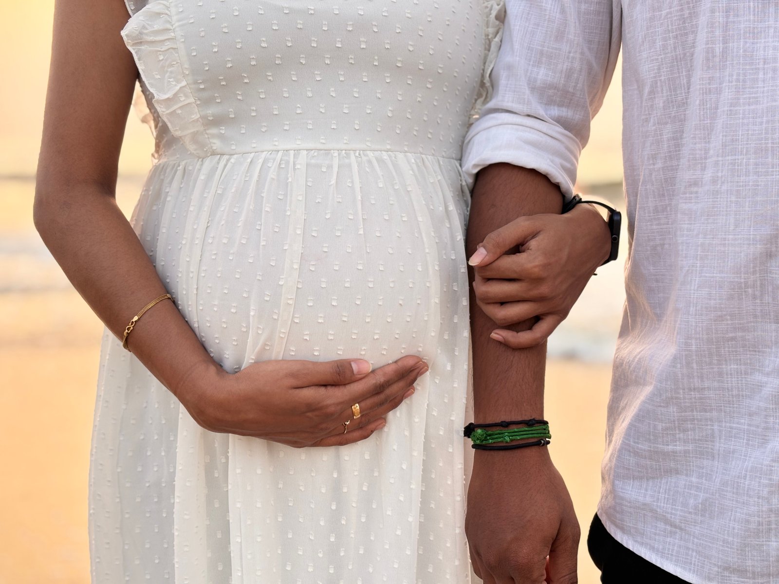 Traditional Valaikaapu glass bangles and henna adorned hands